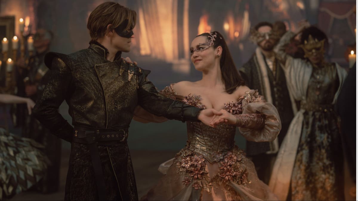 Paul Wesley as James T. Kirk and Christina Chong as La’an Noonien-Singh are dressed as a prince and princess at a masquerade ball in Star Trek: Strange New Worlds, episode 9, season 4, "Once La'An A Time"
